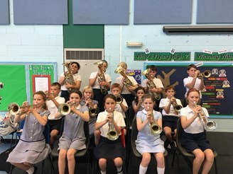Another group of pupils from Grangefield Primary posing with their trumpets