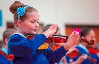 girl holding violin
