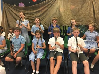 A photo of the pupils of Haresfield Primary playing clarinets